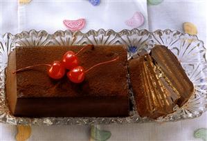 Chocolate cake with cocktail cherries