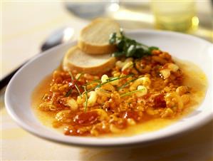 Noodle soup with red lentils and chives