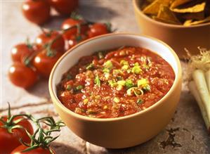 Cooked tomato salsa with spring onions