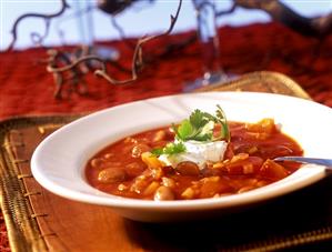 Red pepper and bean soup with coriander cream