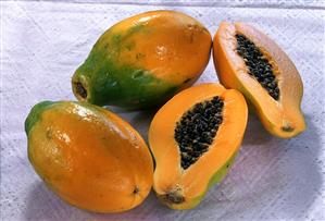 Papayas, one halved