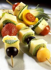 Colourful cheese kebabs with fruit and vegetables