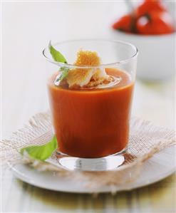 Tomato soup with zwieback (rusk) in glass