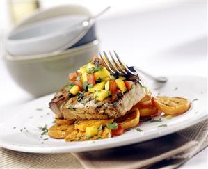 Tuna steak with mango on sweet potatoes