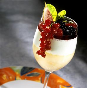 Fruit mousse with cream and red berries