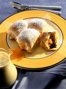 Poppy seed rolls (Buchteln) with apricots in custard