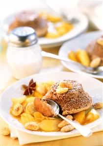 Almond chocolate souffle on orange and pear caramel