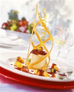 Vanilla cream tower with fried fruit and wafer