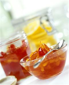 Orange chutney in jar and bowl