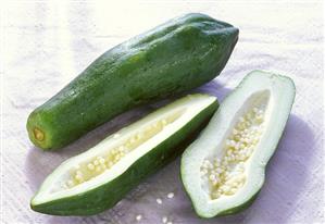 Thai vegetable papayas, one halved