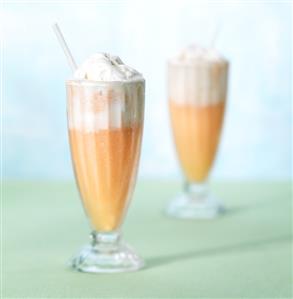 Orange shake with ice cream in glasses