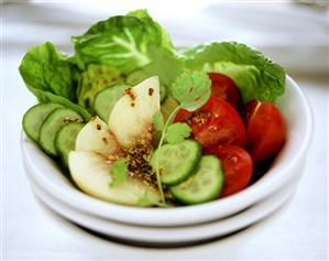 Colourful salad with peach and mustard dressing