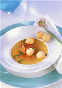 Vegetable bouillon with mini cream puffs