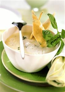 Potato foam soup with basil diamonds