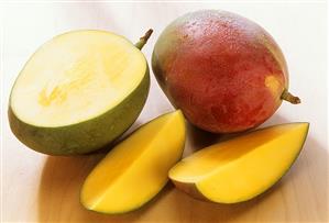 Mangos (Keitt variety) with drops of water