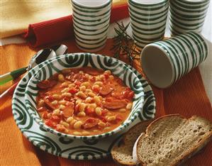 Serbian bean soup with sausage; slices of bread