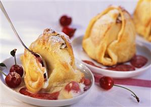 Marzipan apples with cherry sauce (a spoonful taken)