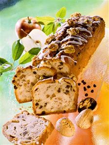 Apple and nut cake with raisins, a piece cut