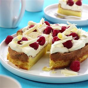 Raspberry gateau with cream and white chocolate curls