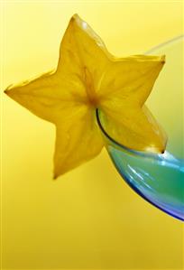 Star fruit on the edge of a glass bowl