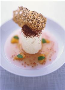 Goat's quark soufflé on peach and champagne sauce