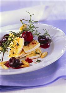 Marinated soft cheese with cherry ragout and rosemary