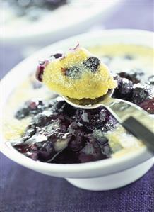 Blueberry pudding with icing sugar