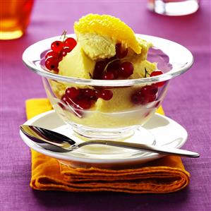 Coconut and mango ice cream with redcurrants