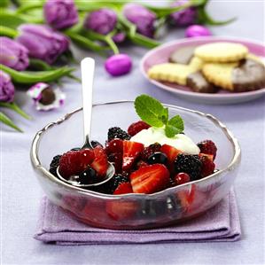 Berry salad with cream and mint