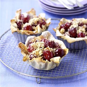 Cherry tarts on cake rack