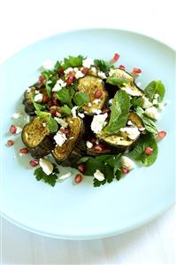 Aubergine salad with pomegranate seeds, herbs & feta