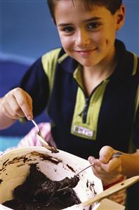 Small boy making chocolate biscuits (1)