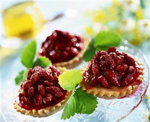 Small cake with wild strawberries