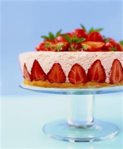 Strawberry flan with strawberry mousse on cake stand