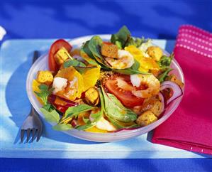 Salad leaves with vegetables, shrimps and oranges