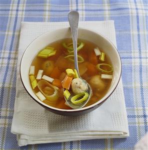 Chicken soup with matzeknaidlach (bread dumplings, Jewish)