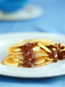 Crepes with bananas and chocolate sauce