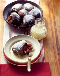 Yeasted chocolate rolls with plums and custard