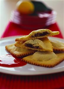 Ravioli with chocolate filling and strawberry sauce