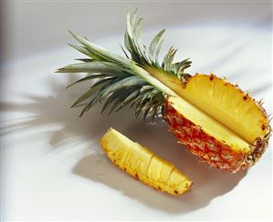 Fresh pineapple, a piece cut off