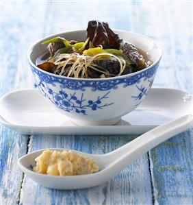 Sour spicy soup with beef and mushrooms (China)