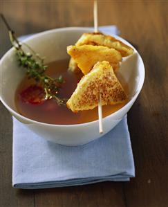 Chicken broth with Parmesan croutons and cherry tomatoes