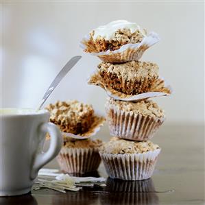 Chocolate muffins in paper cases (in a pile)