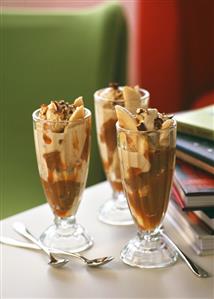 Sundae with banana, nut ice cream and caramel sauce