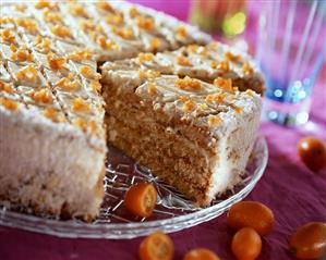 Sponge cake with kumquats, a piece cut