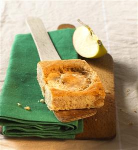 A piece of quick apple cake on server