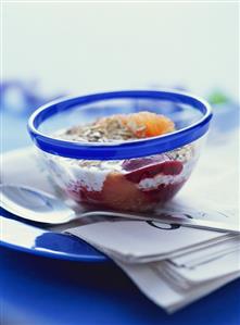 Muesli with berry puree, orange and sunflower seeds