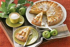 Apple cake, slices cut, one piece on plate