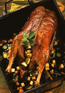 Roast goose with quinces and spring onions