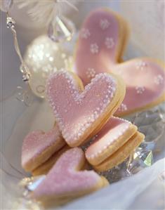 Pink sweet pastry hearts with jam filling